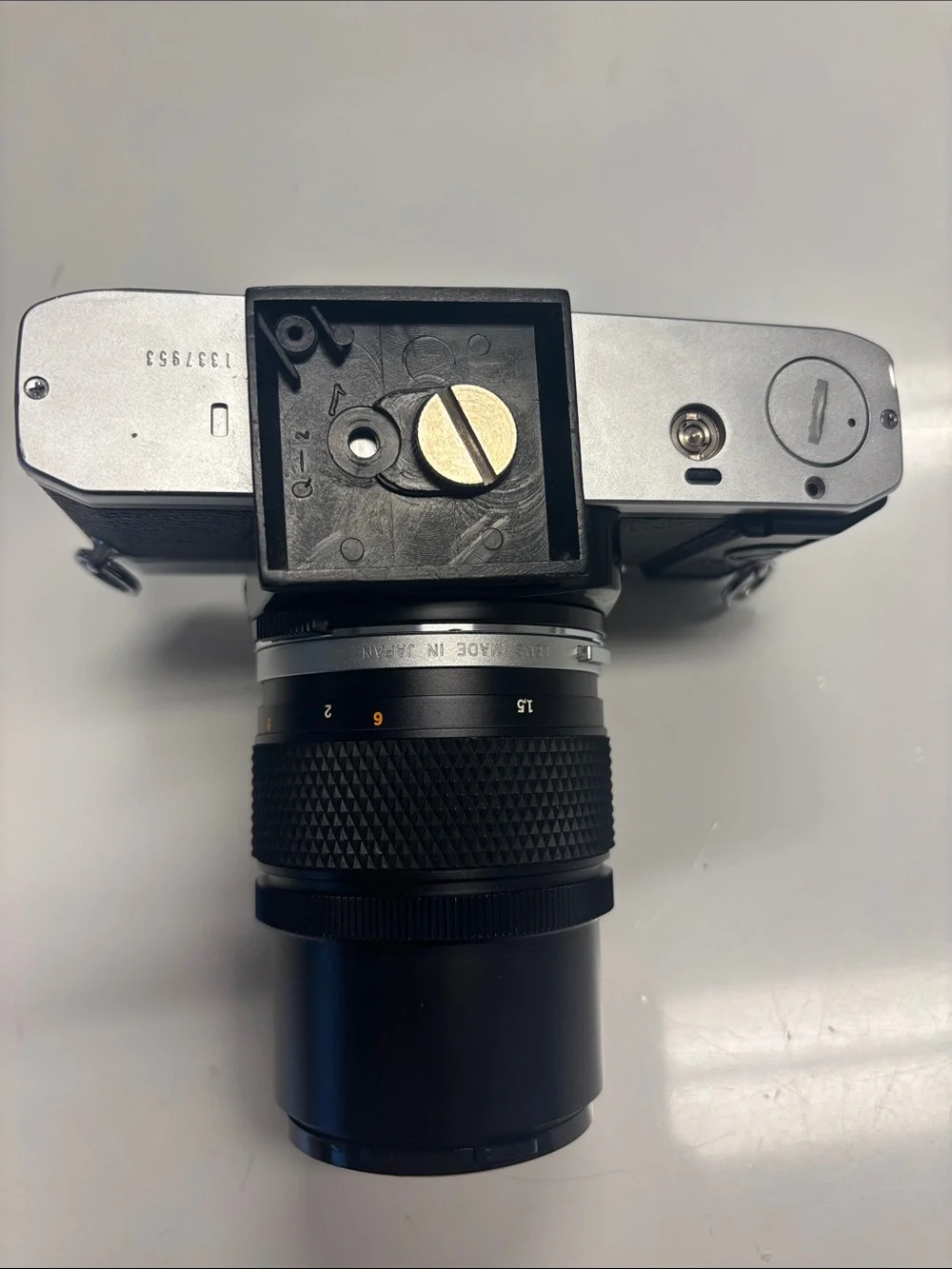 Olympus OM-G Film Camera + 135 mm lens.